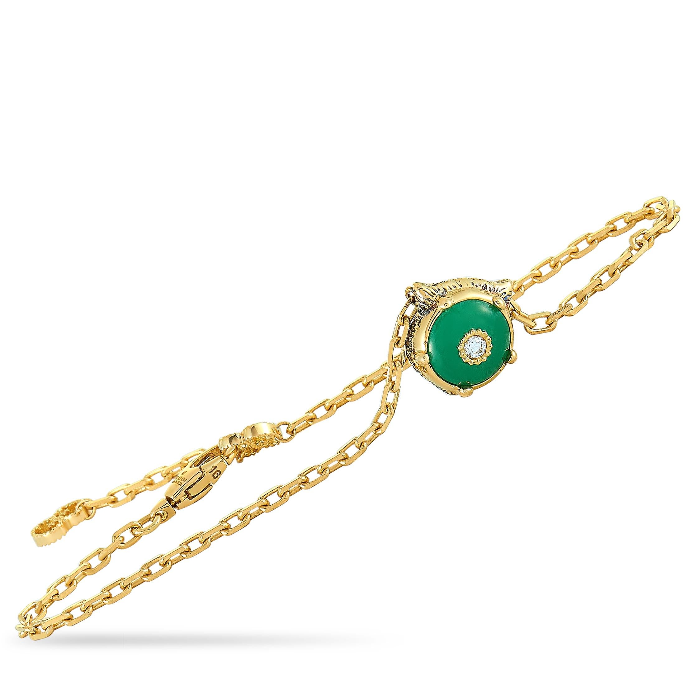 The Gucci “LMDM” bracelet is crafted from 18K yellow gold and set with a jade and three diamond stones. The jade weighs approximately 1.45 carats and the diamonds boast GH color and VVS clarity and amount to approximately 0.05 carats. The bracelet
