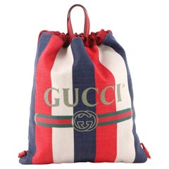 Gucci Logo Rucksack mit Kordelzug aus gestreiftem Segeltuch Groß