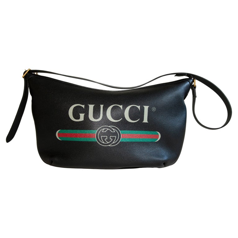 Borsa Hobo grande in pelle nera con logo Gucci stampato a