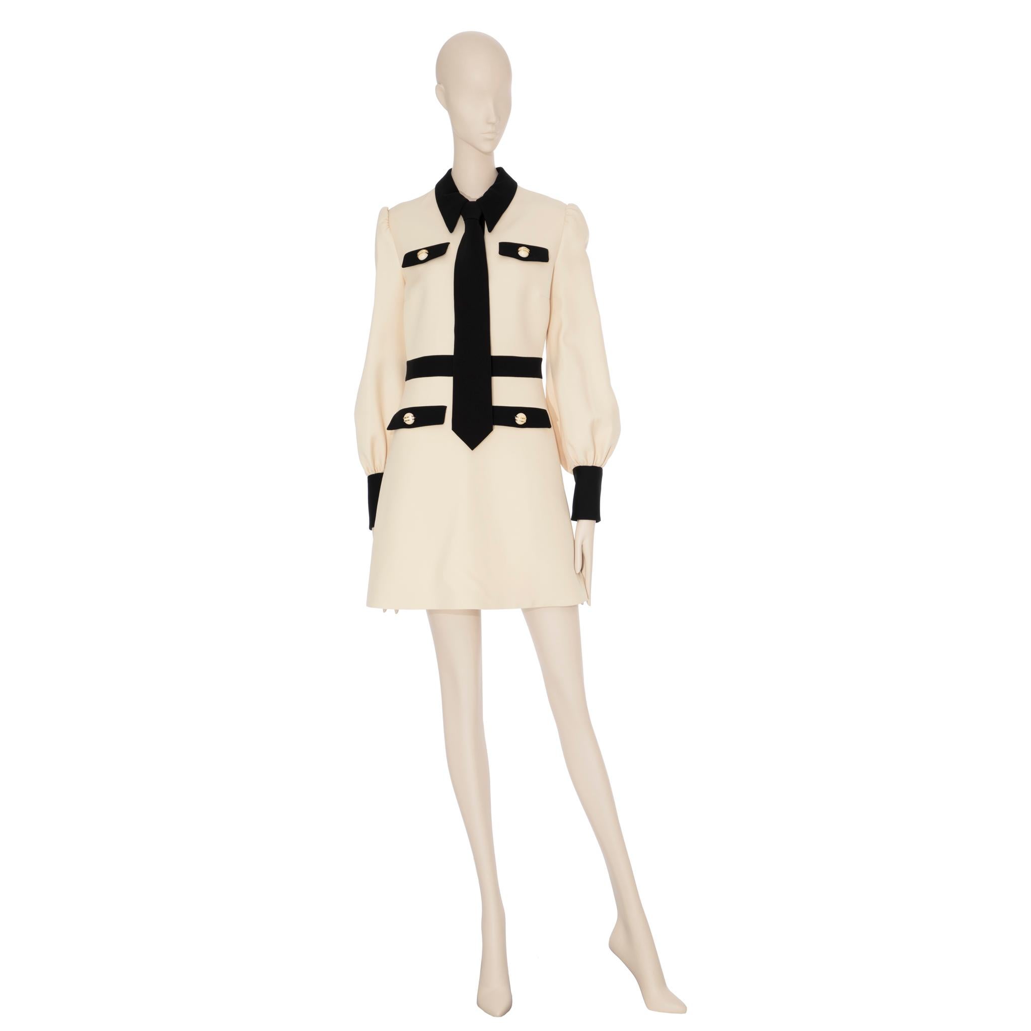Brand:

Gucci

Product:

Long Sleeve Dress With Tie

Size:

40 It

Colour:

Ivory & Black

Material

Wool 51% & Silk 49%

Condition:

Pristine; New Or Never Worn

Details

- Long Sleeve Wool And Silk-Blend Crepe Short Dress

- Three Ornamental