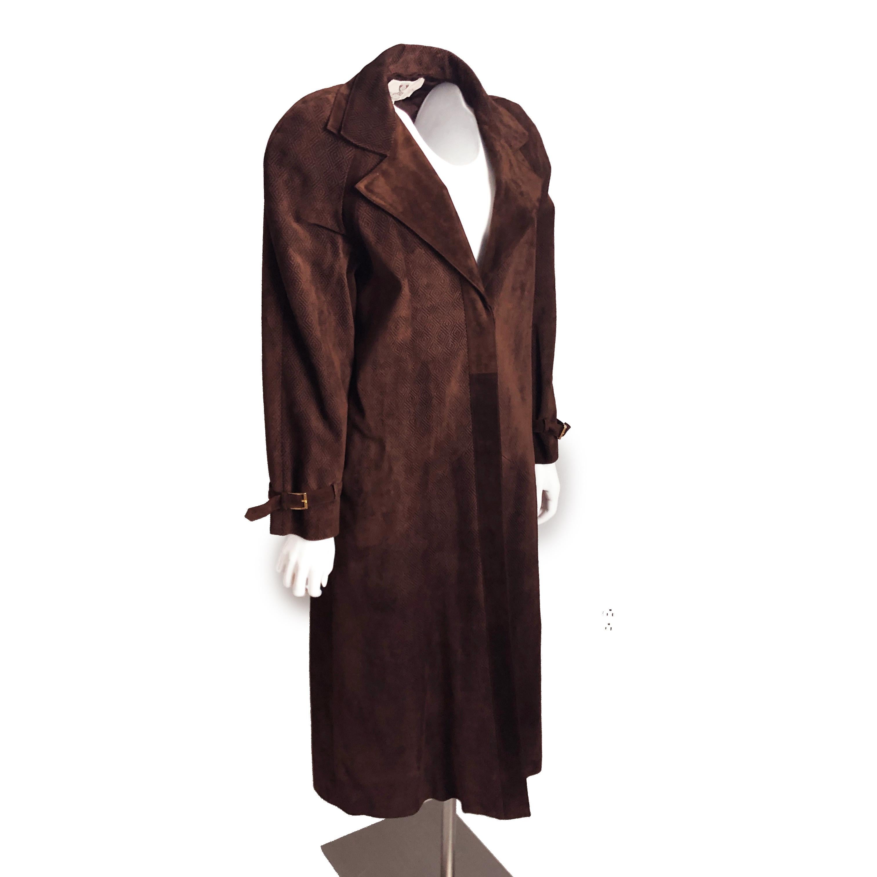 A wonderful vintage suede leather coat and skirt ensemble, made by Gucci most likely in the late 1970s or early 80s.

Made from an incredibly supple chocolate suede leather with diamond textured patterns throughout, the coat features cinched