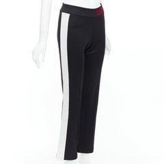 GUCCI LOVED red embroidered black piped flare track pants