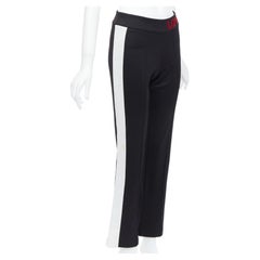 GUCCI LOVED red embroidered black piped flare track pants