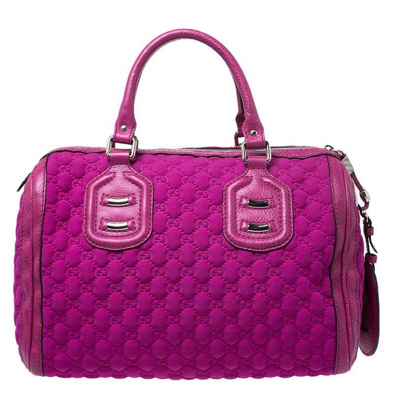 Crafted with Guccissima neoprene and leather, you will find this bag an ideal companion for all your needs. The inside nylon is lined well and sized perfectly. This Gucci magenta bag is simply unmatched in its rich and classic design.

Includes: