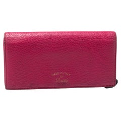 Gucci - Portefeuille continental pivotant en cuir magenta