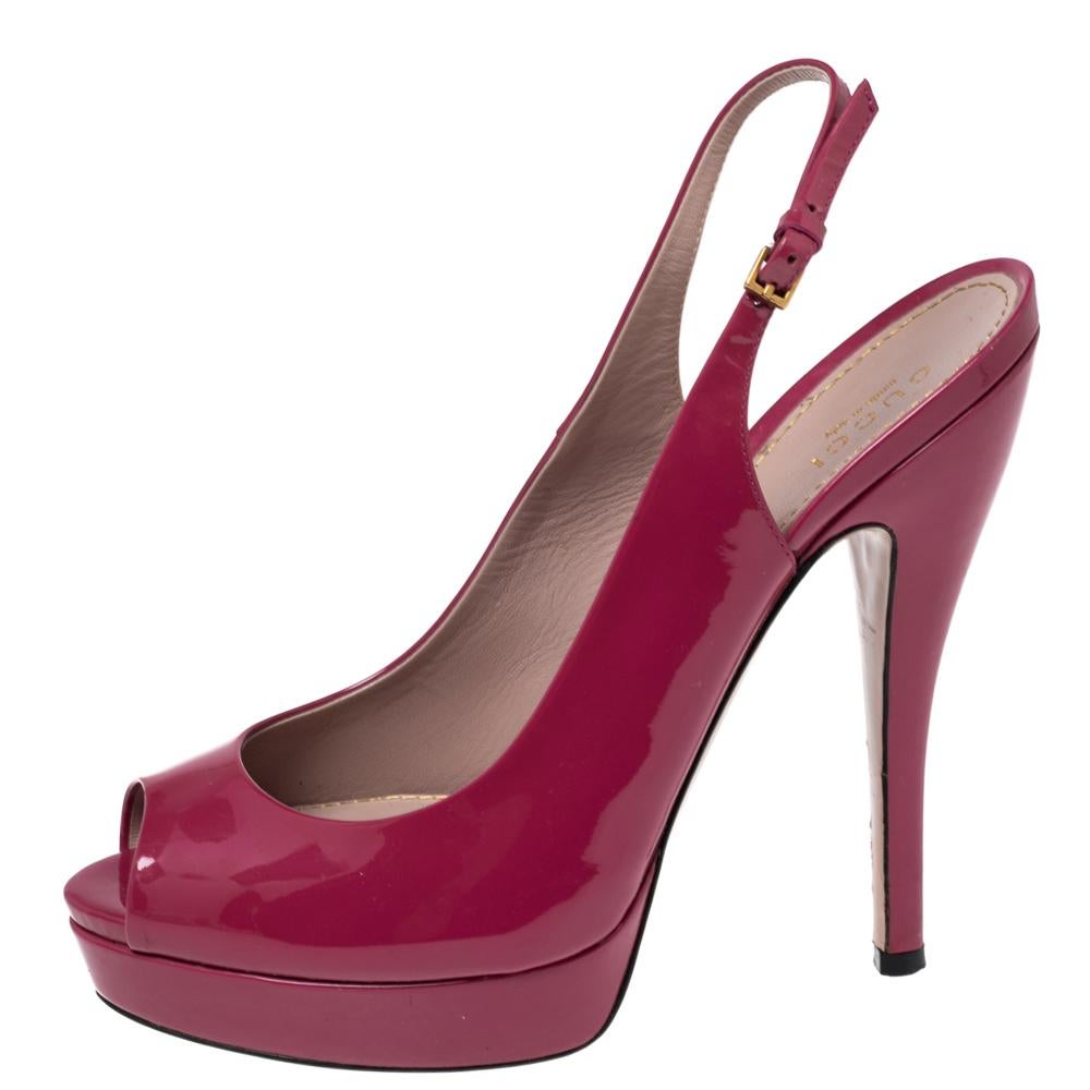 A beautiful pair of Gucci shoes that are easy to wear and yet perfect to dress you up, these sandals are highly versatile. Constructed in magenta patent leather, these shoes feature peep toes with a slingback buckled closure and a platform that