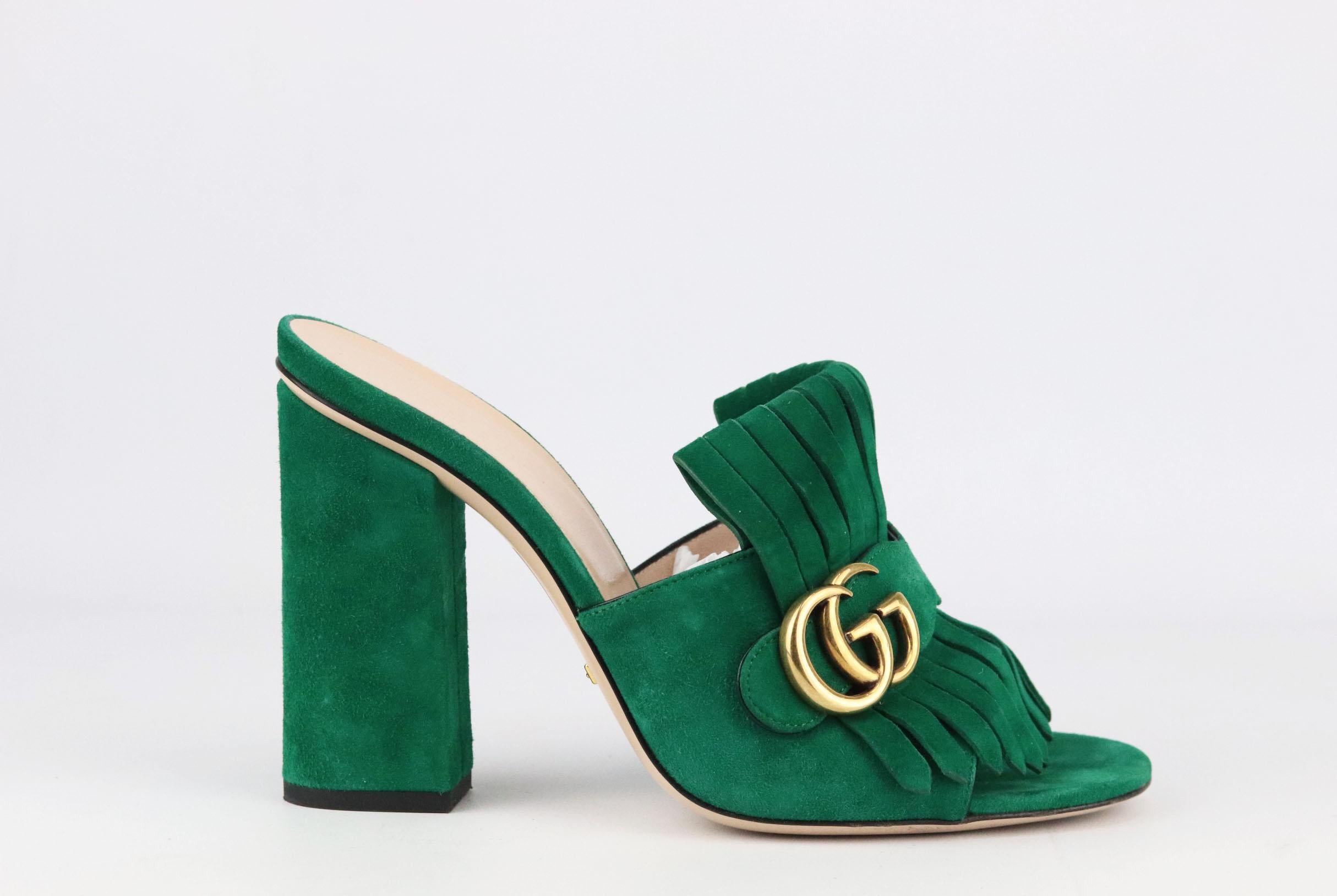 Gucci's 'Marmont' shoes are coveted by fashion influencers, editors and celebrities alike, made in Italy from smooth green suede, these mules are detailed with heritage kiltie fringing and the house's iconic burnished 'GG' plaque. 
Soles measures