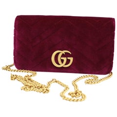 Gucci Marmont GG clutch in purple velvet.