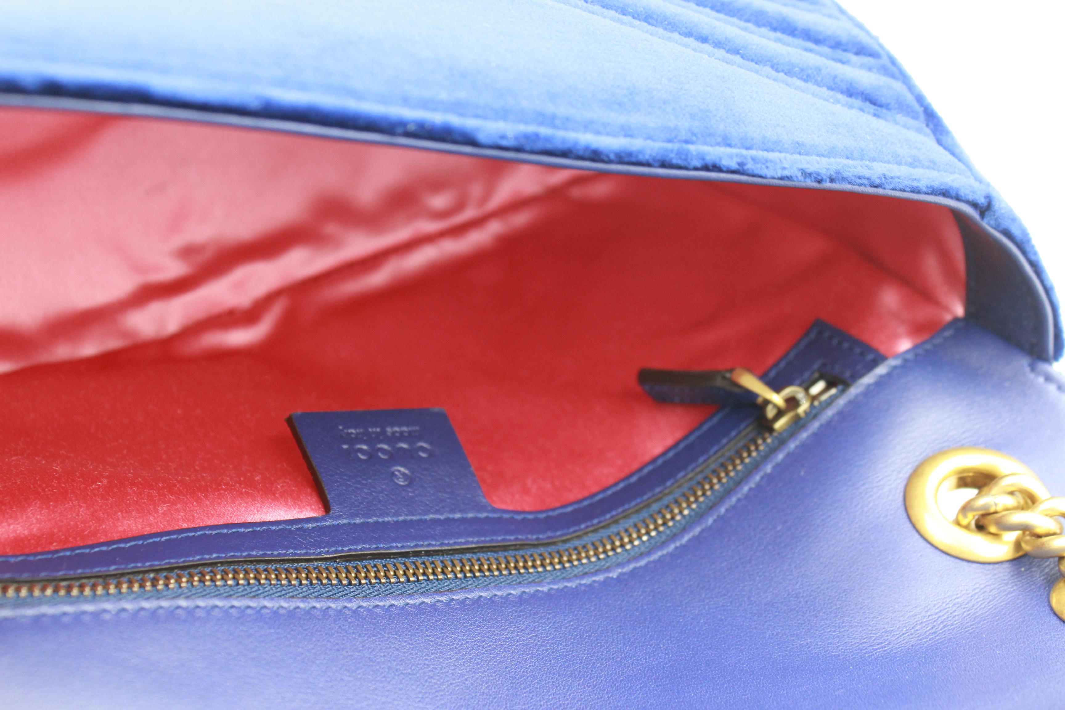 Blue Gucci Marmont GG handbag in dark blue velvet.