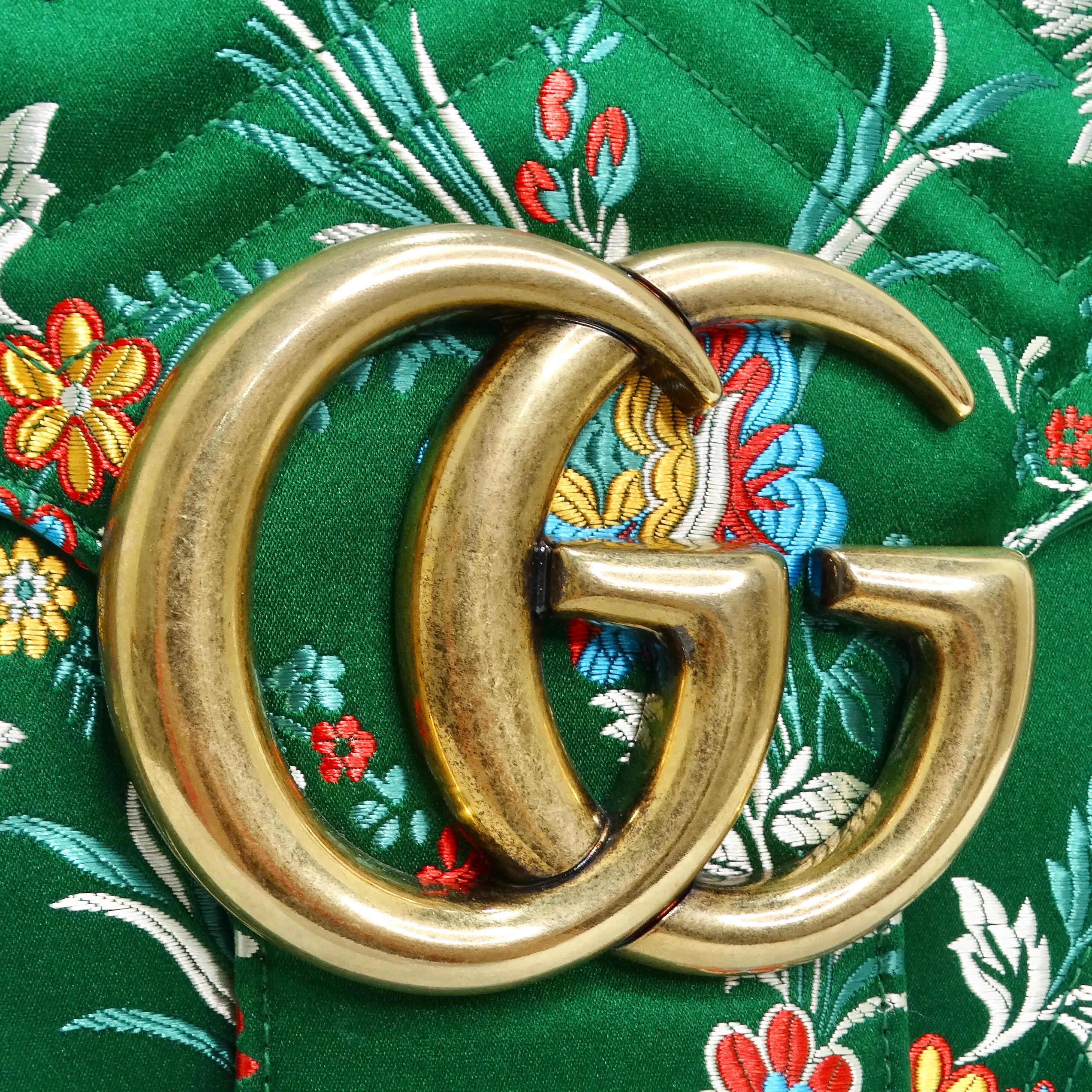 Introducing the Gucci Marmont Jacquard Matelassé Floral Maxi Top Handle Shoulder Bag—a true embodiment of luxury, craftsmanship, and exquisite design. This stunning shoulder bag is a visual masterpiece, showcasing Gucci's meticulous attention to