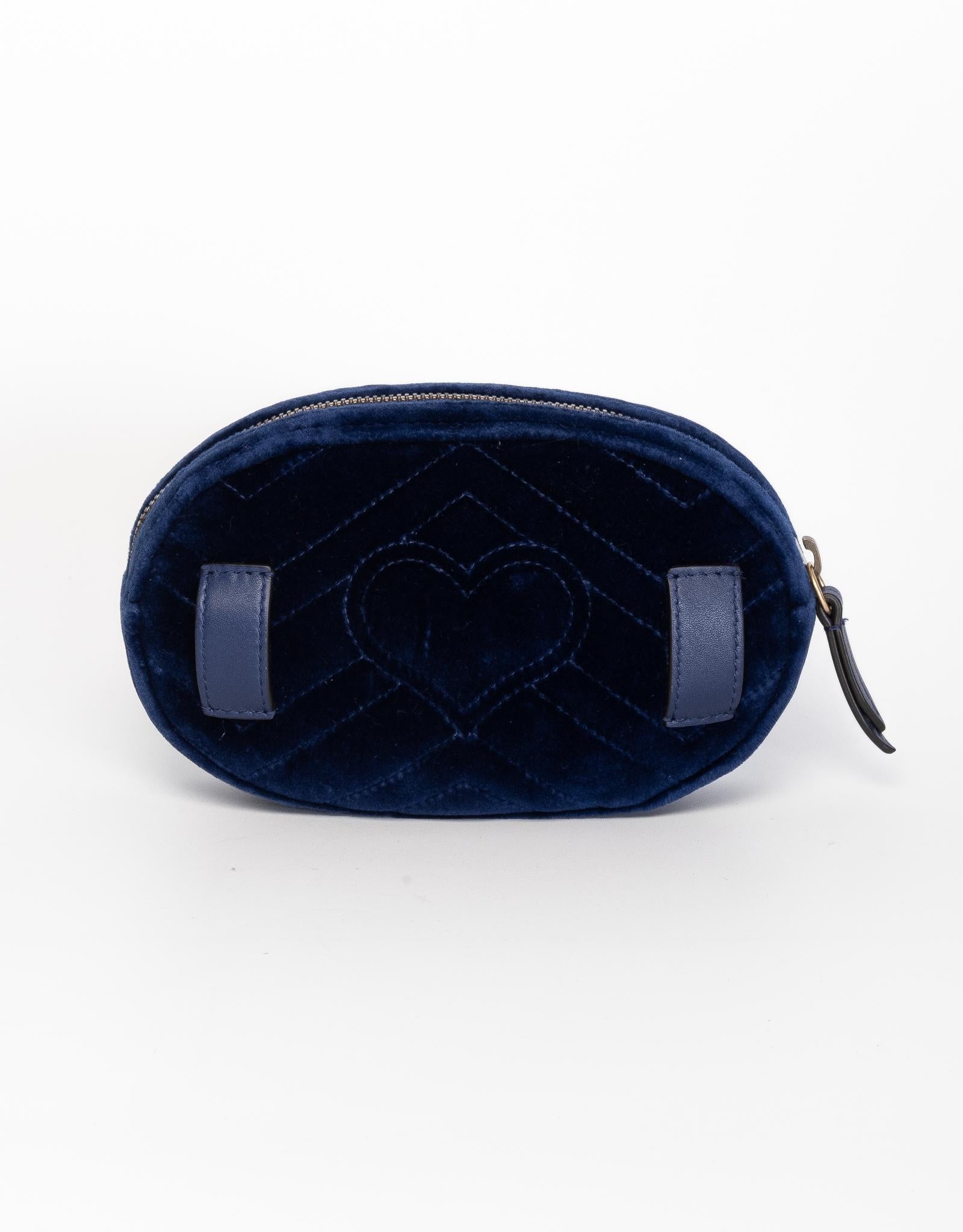 The GG Marmont belt bag is made of in velvet with a stitched chevron pattern and features a rounded shape with a retro sportswear 90s influence. Finished with the Double G detail, blue leather belt and antique gold-toned hardware. The leather belt