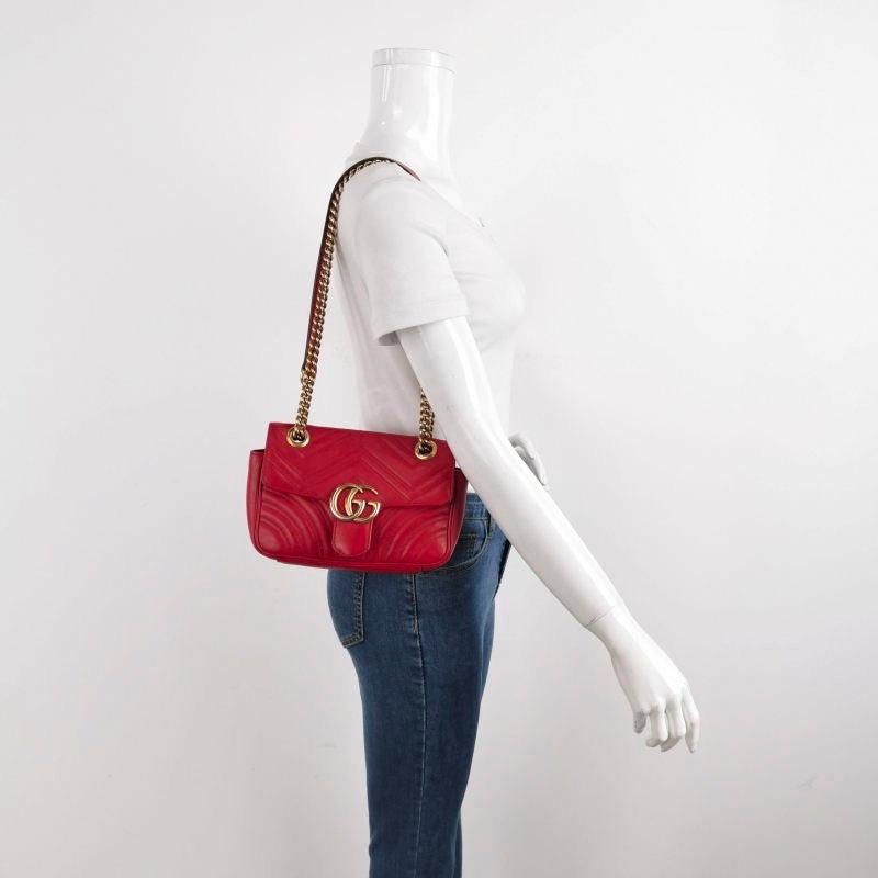 Gucci Marmont Mini Flap Red Leather Handbag
 These are professional photos of the actual bag offered by Luxbags.
 The Gucci Marmont Mini Flap Crossbody Bag is a timeless and adaptable accessory designed by the renowned brand Gucci. Its signature