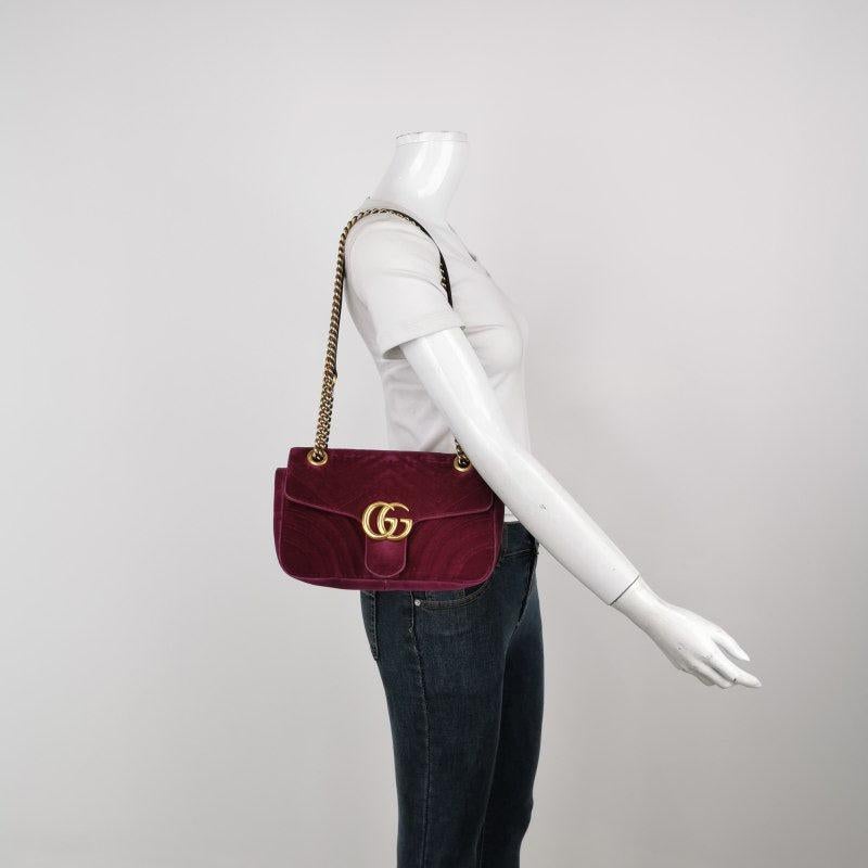 Gucci Marmont Small Flap Pink Velvet Handbag
 These are professional photos of the actual bag offered by Luxbags.
 The Gucci Marmont Mini Flap Pink Velvet Crossbody Bag is a timeless and adaptable accessory designed by the renowned brand Gucci. Its