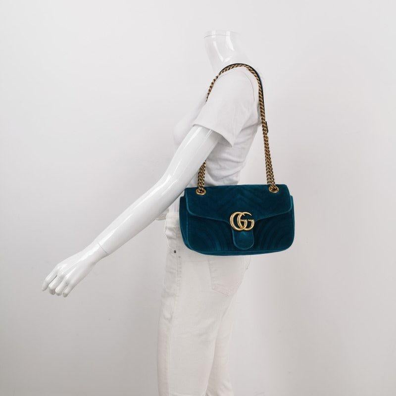 Gucci Marmont Small Flap Turquoise Blue Velvet Handbag
 These are professional photos of the actual bag.
 The Gucci Marmont Mini Flap Velvet Crossbody Bag is a timeless and adaptable accessory designed by the renowned brand Gucci. Its signature