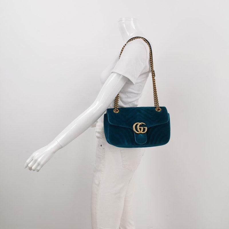 Gucci Marmont Small Flap Turquoise Blue Velvet Handbag
 These are professional photos of the actual bag.
 The Gucci Marmont Mini Flap Velvet Crossbody Bag is a timeless and adaptable accessory designed by the renowned brand Gucci. Its signature
