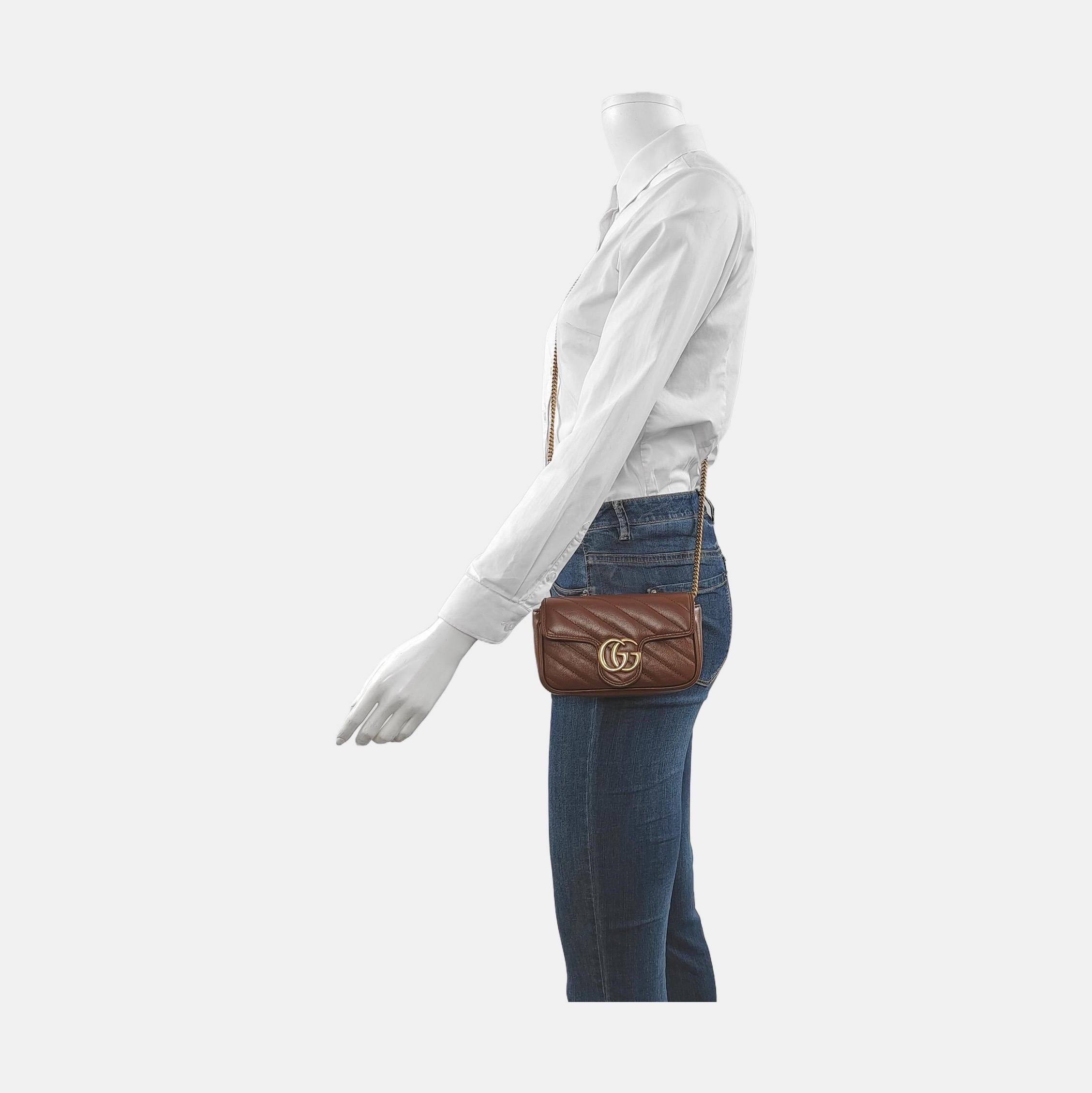 The Gucci Marmont Bag is a timeless and adaptable accessory designed by the renowned brand Gucci. Its signature diagonal stitching and prominent GG logo hardware on the flap opening make it instantly recognizable. The gold-tone chain and leather