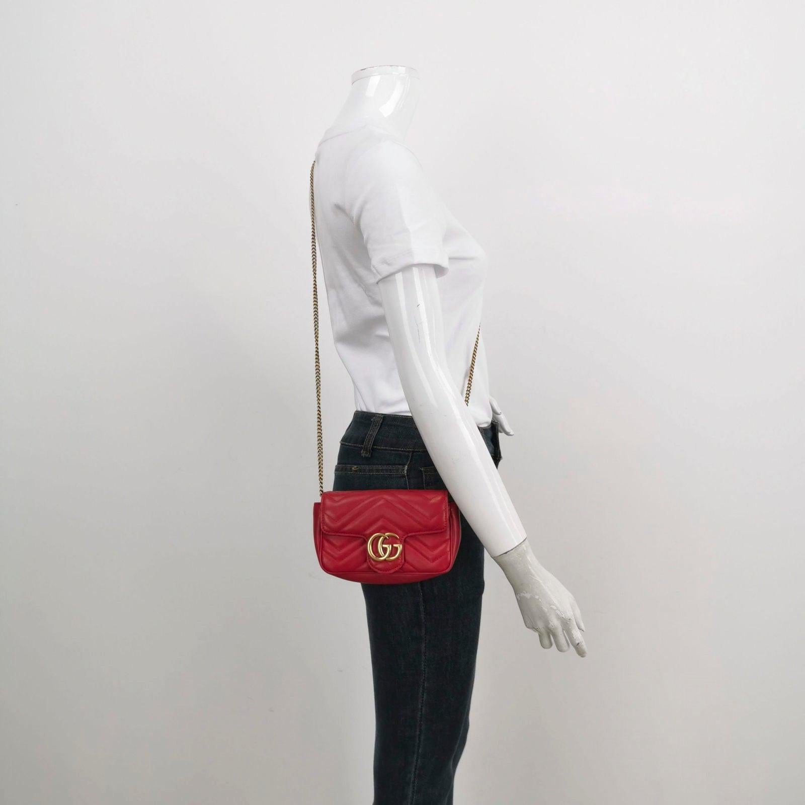 Gucci Marmont Super Mini Flap Leather Bag Red Leather These are professional photos of the actual bag offered by Luxbags. The Gucci Marmont Bag is a timeless and adaptable accessory designed by the renowned brand Gucci. Its signature diagonal