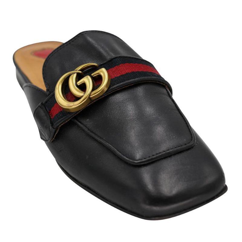 Gucci Marmont Sz 38 Peyton Leather Slippers Slides GG-S0205N-0001

Slip into these comfortable and fashionable mules from Gucci. Featuring gold hardware red & green stripes with the classic gold GG Marmont buckle and signature web detail. These