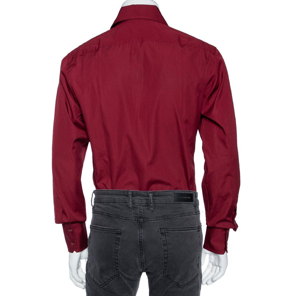 Shirts are an indispensable part of a man's wardrobe, so Gucci brings you a creation that is both versatile and stylish. It has been tailored from cotton in a maroon shade. The shirt is detailed with front buttons, a classic collar, and long