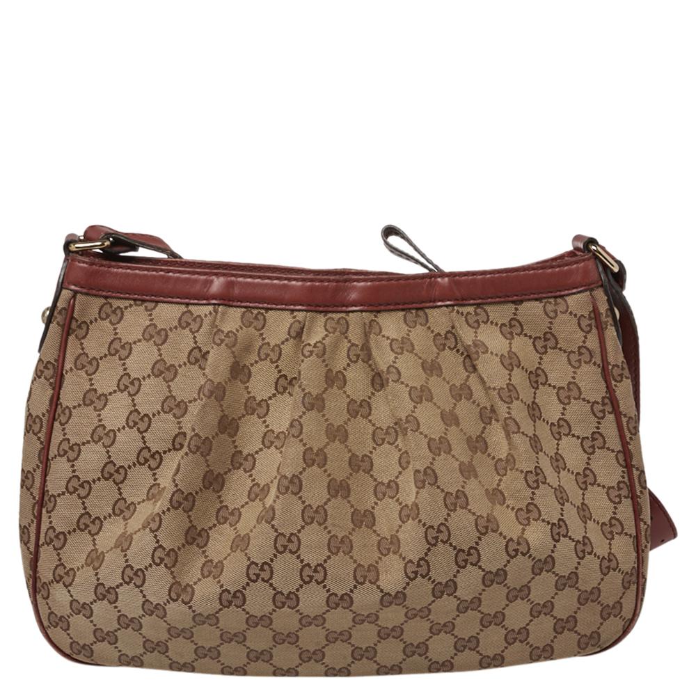 One of Gucci’s best-loved designs in signature GG canvas, this Sukey messenger bag is both utilitarian and trendy. The main compartment is secured with a zip. The inner lining is canvas with a zippered pocket on one side. The sleek adjustable