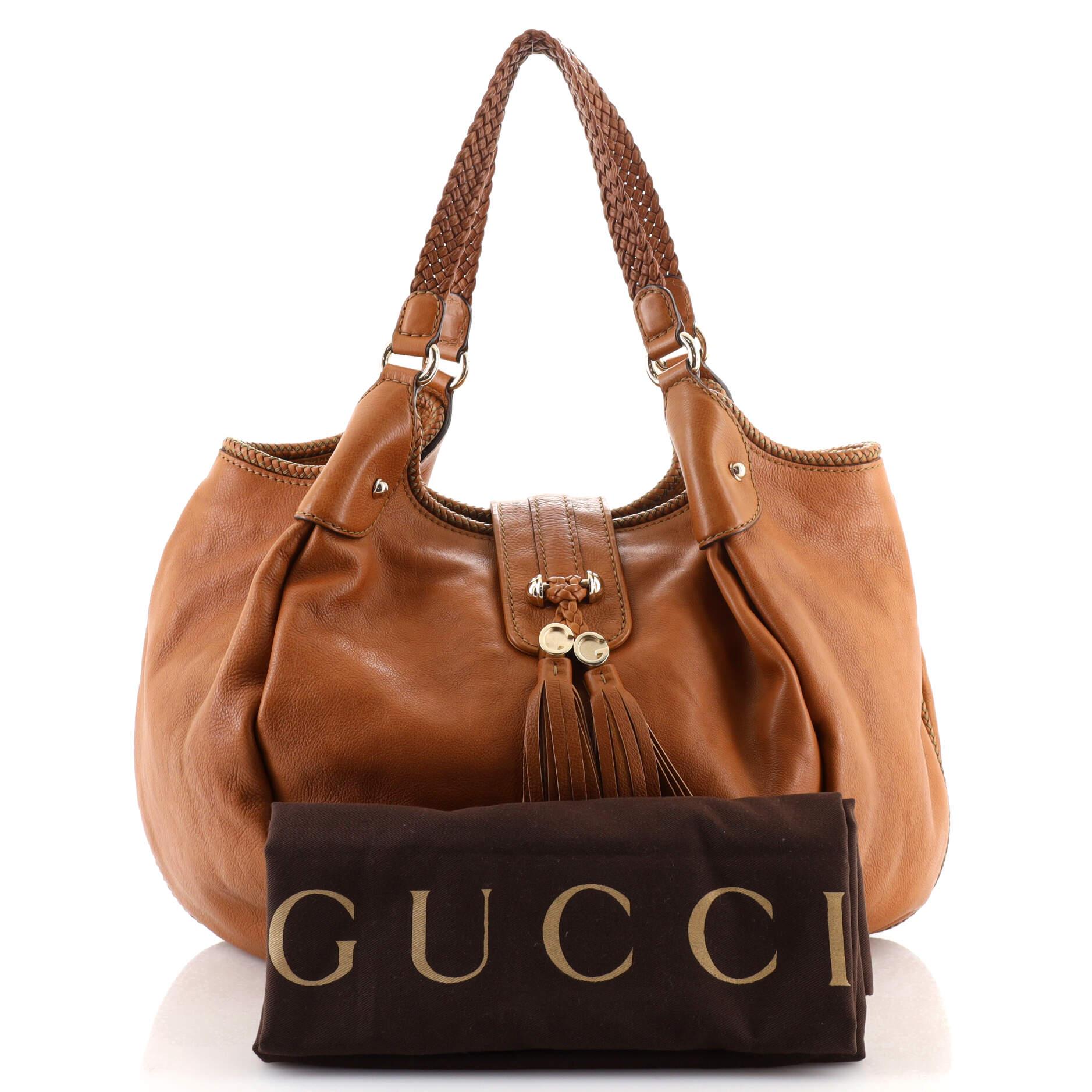 Condition: Very good. Discoloration, scuffs and creasing on exterior, splitting on handle base wax edges, minor wear in interior, scratches on hardware.
Accessories: Dust Bag
Measurements: Handle Drop 10