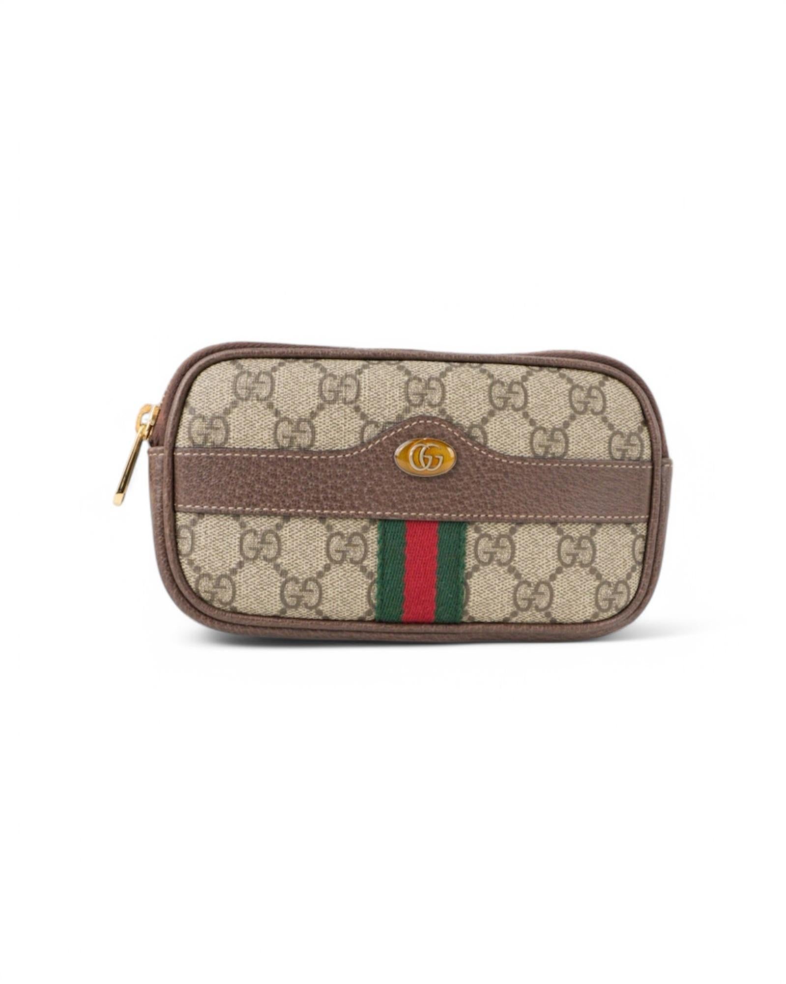Gucci signature fanny pack, Ophidia line, made of canvas with classic GG Supreme pattern, brown leather inserts and gold hardware. Featuring a top zipper closure, the interior is lined in beige suede fabric and has small document compartments,