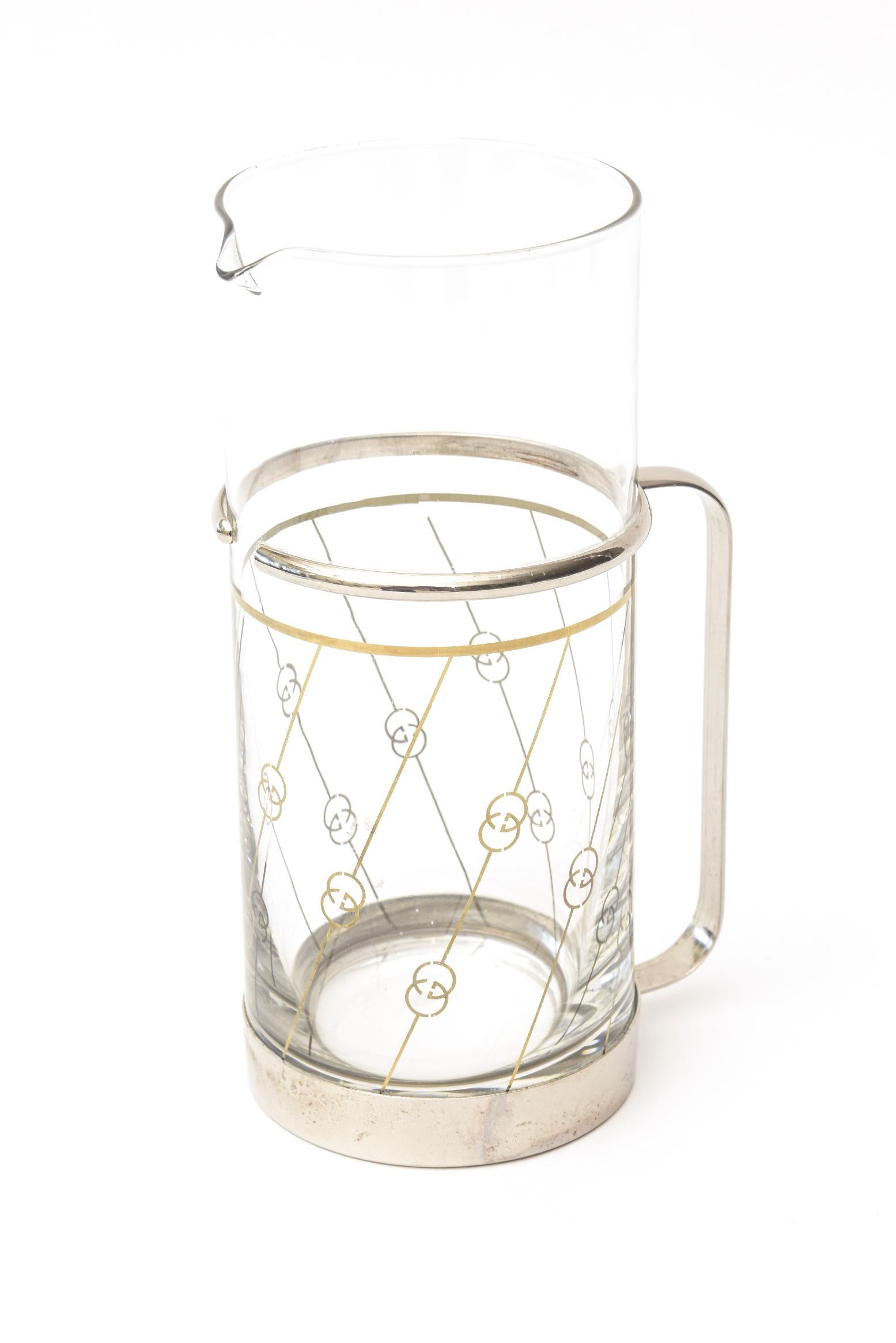 This Italian hallmarked Gucci martini pitcher is from the 1970s. It is silver plate and glass. It is marked Gucci Marked in Italy. It is so chic. Great barware.