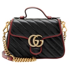 Mini sac à main Gucci en cuir matelassé « Torchon GG Marmont » avec poignée sur le dessus
