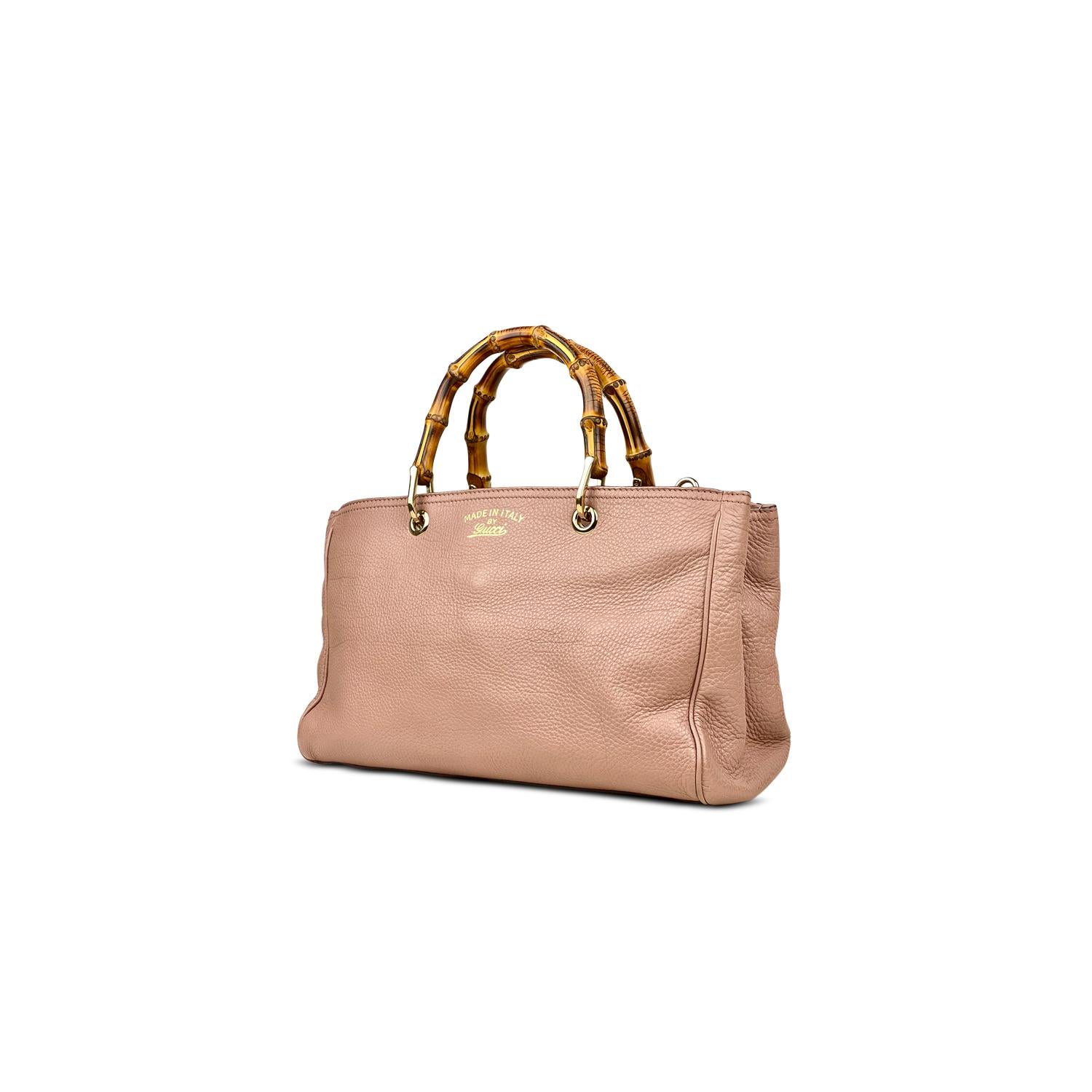 Pink grained leather Gucci Medium Shopper tote with

- Silver-tone hardware
- Removable single flat shoulder strap with buckle adjustment
- Dual bamboo top handles, foil-stamped logo at front face, protective metal feet at base, three interior