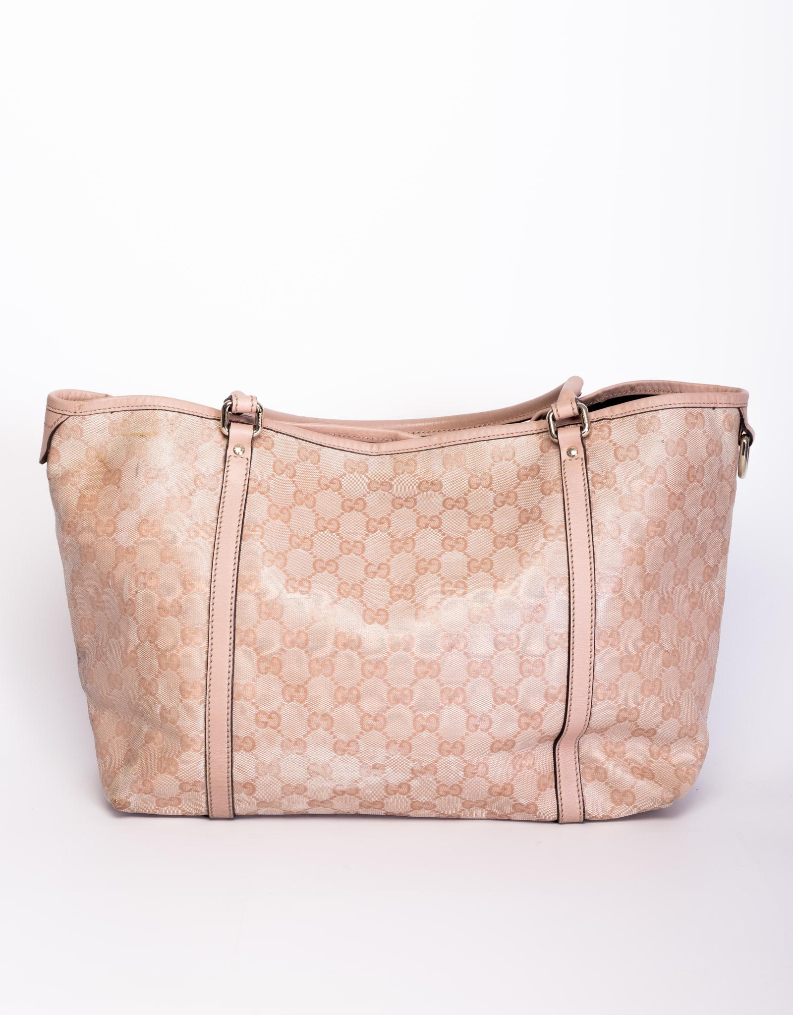 This Gucci tote bag is made out of coded canvas with the Gucci web GG monogram.  Featuring leather finishes, dual tall handles, an open top with brown woven interior lining.

COLOR: Pink
MATERIAL: Coated canvas with leather finishes 
ITEM CODE: