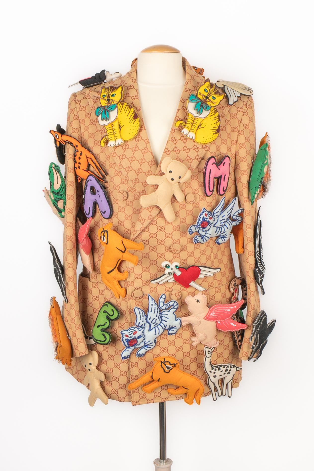 GUCCI - (Made in Italy) Monogram men jacket entirely overlaid with cuddly toy brooches bearing the effigy of the Chinese zodiac signs. No size indicated, it fits a S/M. 2019 February Limited Edition Collection celebrating the Chinese New Year, for
