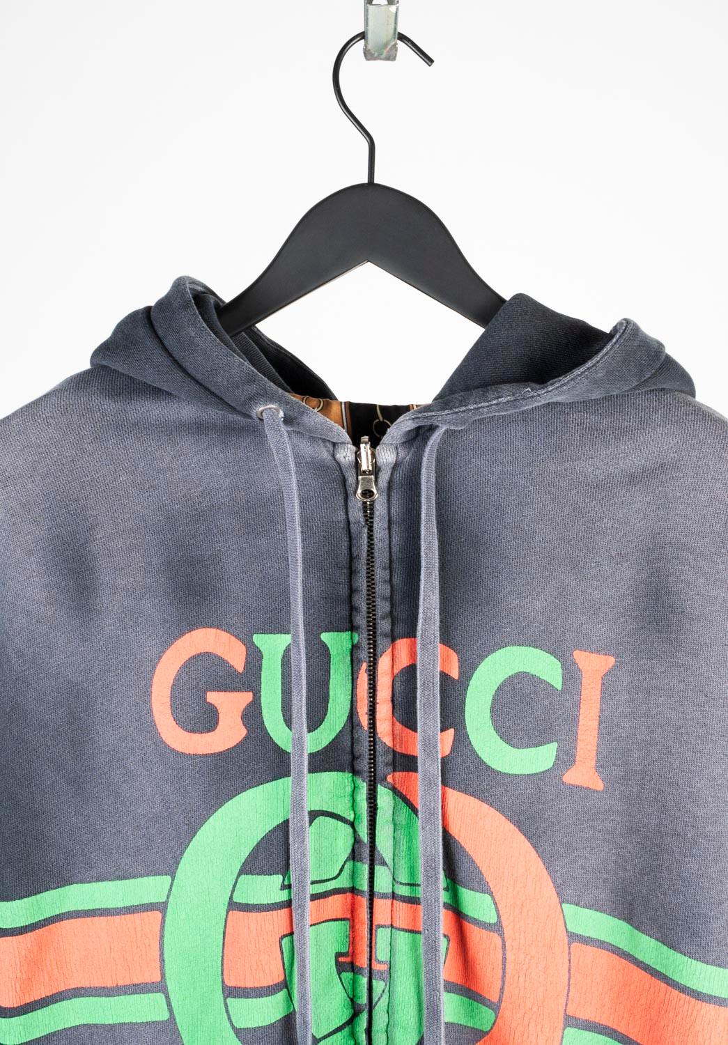 100% genuine Gucci Reversible Jacket Jumper, S669 
Color: grey
(An actual color may a bit vary due to individual computer screen interpretation)
Material: 100% cotton, other part is 100% Silk.
Tag size: M (runs oversized like Large)
This jumper is