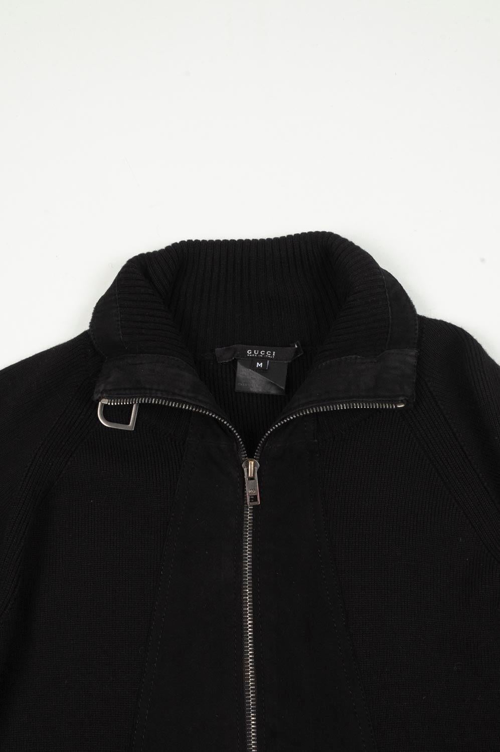 Check my other listings. Have many more designer clothes for sale. Open to any offers.
Item for sale is 100% genuine Gucci Wool/Suede Men Sweater, S525
Color: Black
Material: Wool and very front part leather
Tag size: M 
This jacket is great quality