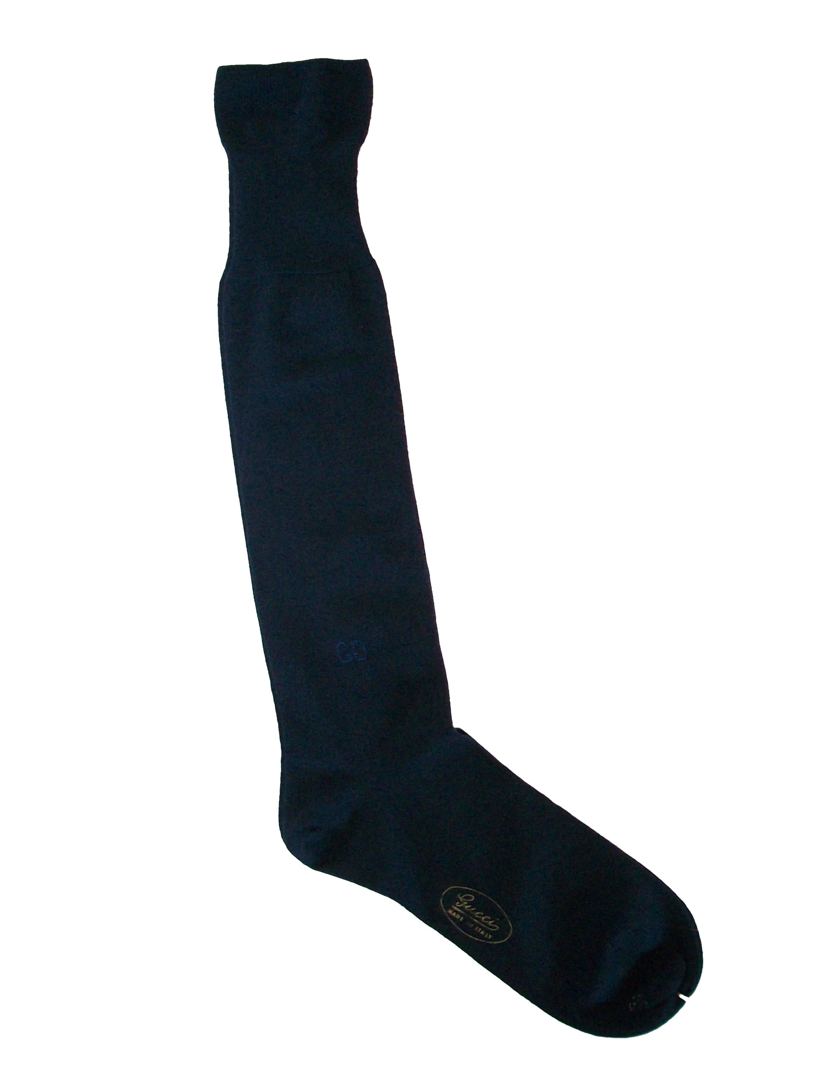 GUCCI - Vintage men's luxe navy blue dress socks - 70% cashmere/30% silk - knee high with fold-over cuffs - hand sewn/embroidered GG logo to each sock - original retail label - Italy - circa 1980's.

Excellent condition - never worn/new with tags -