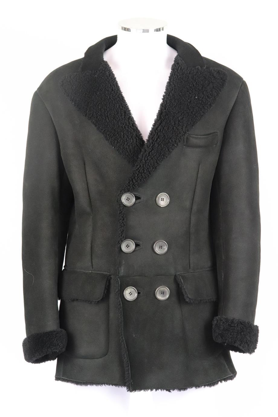 Gucci men's double breasted shearling lined suede coat. Black. Long sleeve, v-neck. Button fastening at front. 100% Leather. Size: IT 50 (Large, EU 50, UK/US Chest 40). Shoulder to shoulder: 20 in. Chest: 44 in. Waist: 42 in. Length: 33 in. Fair