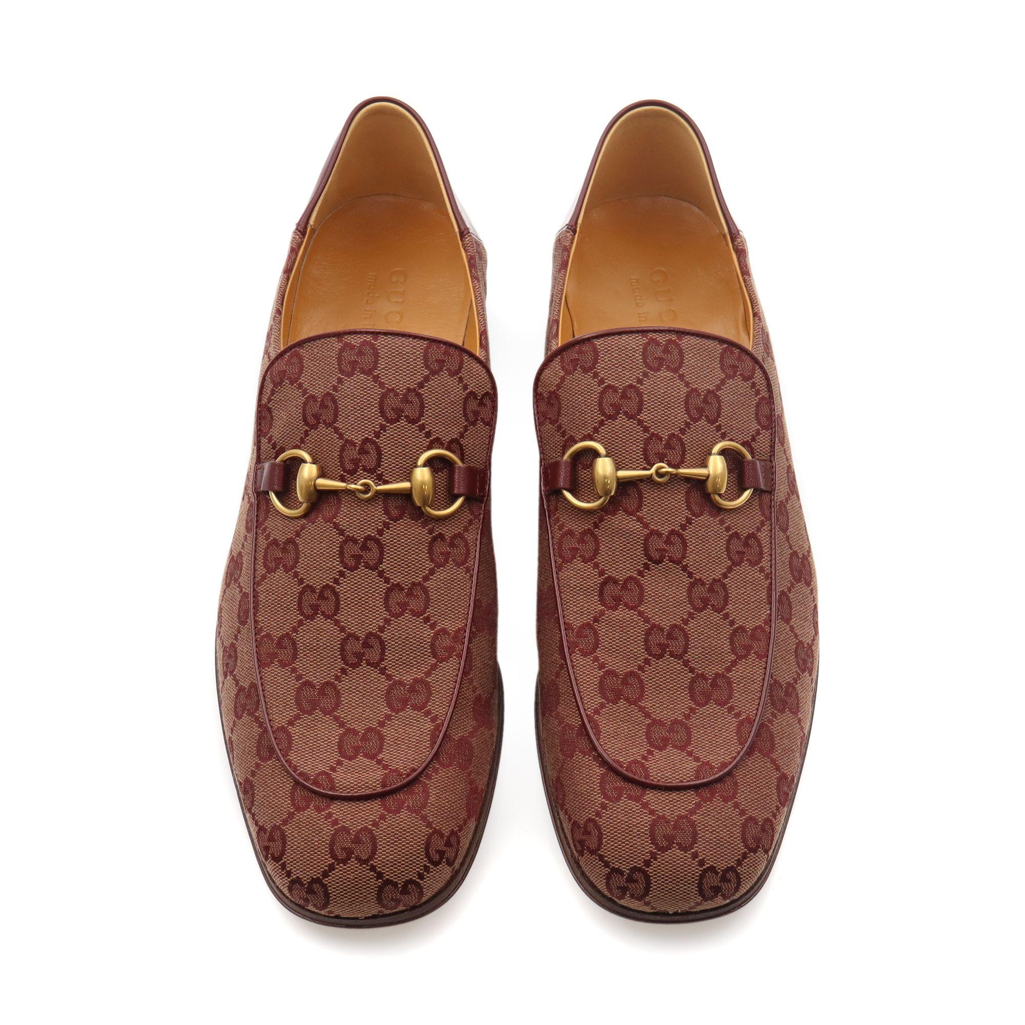 The antiqued gold-tone metal Horsebit seen on the front of these burgundy Mister GG Supreme canvas loafers pays tribute to Gucci's storied heritage and its equestrian influences. Expertly crafted in Italy to a rounded square toe, they are set on a