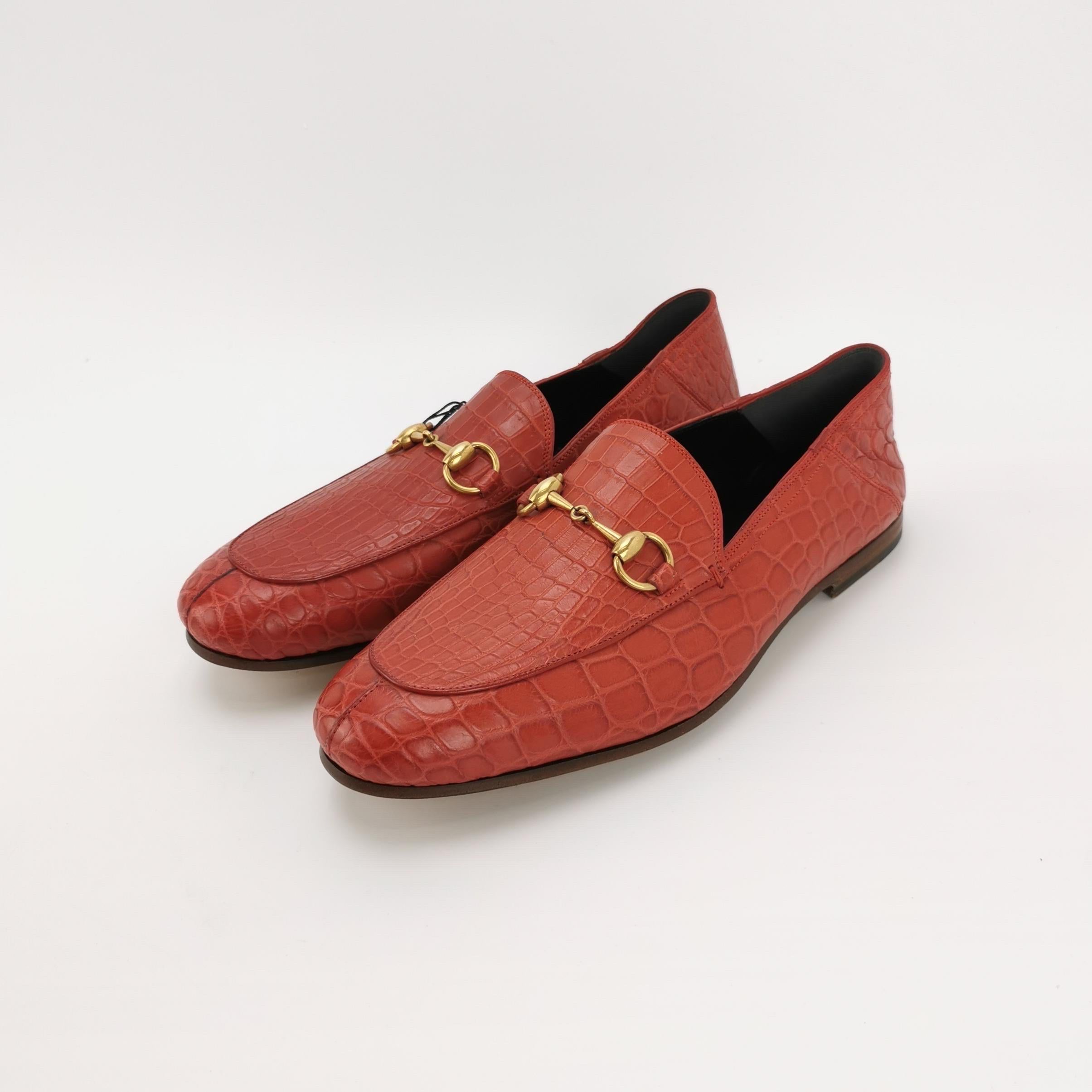 Elevate your formal wardrobe with this distinguished Gucci loafer, where luxurious red crocodile leather meets timeless design. The iconic Horsebit detail adds refined sophistication, while Blake construction ensures a lightweight, supple feel that