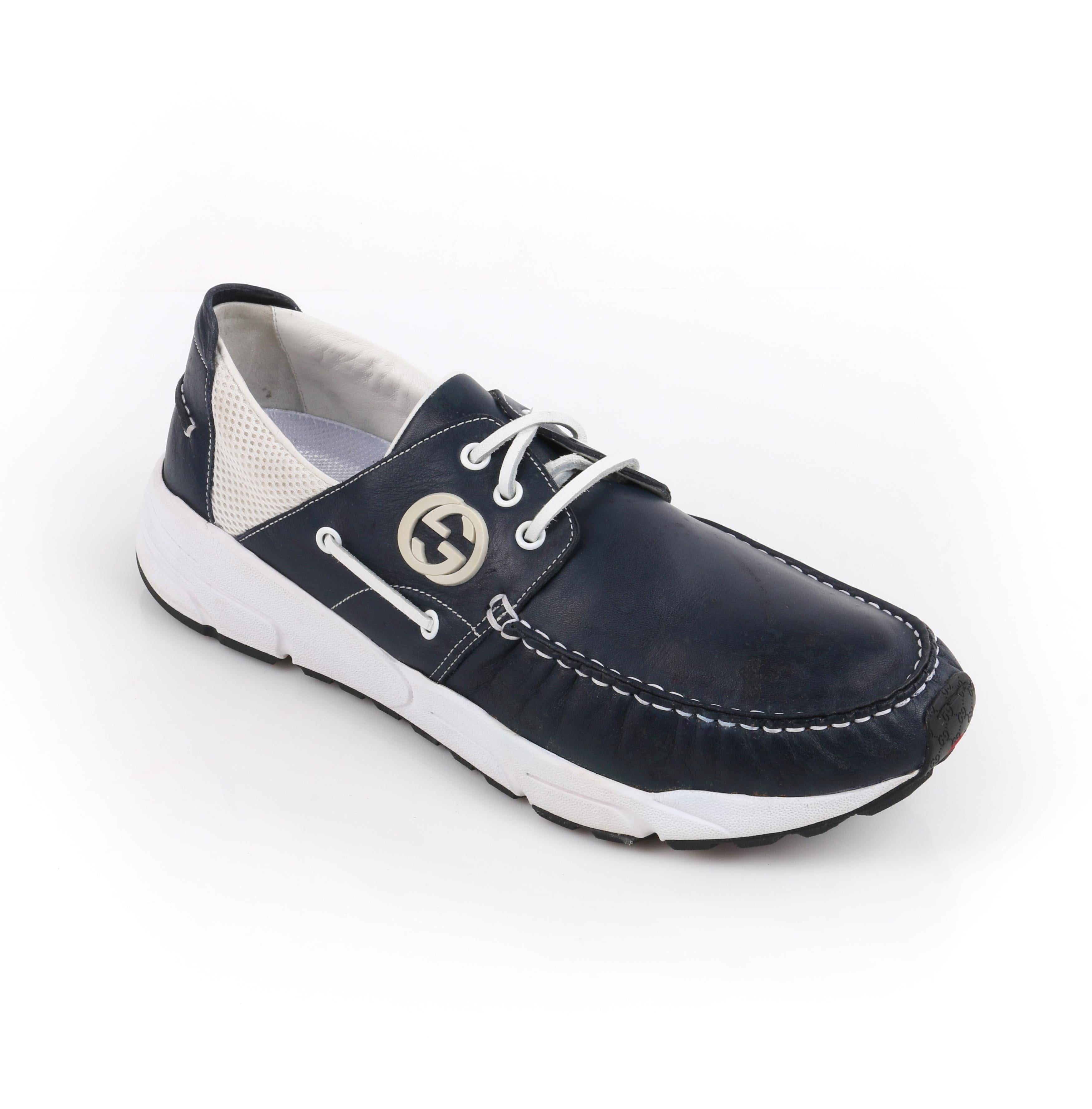 GUCCI Men's Leather Rubber Sole Lace Up Low Top Athletic Boat Shoes 
 
Brand / Manufacturer: Gucci
Style: Men's boat shoes 
Color(s): Shades of white, red, black, and blue
Unmarked Materials (feel of): Upper, laces: leather; lining: leather; sole,