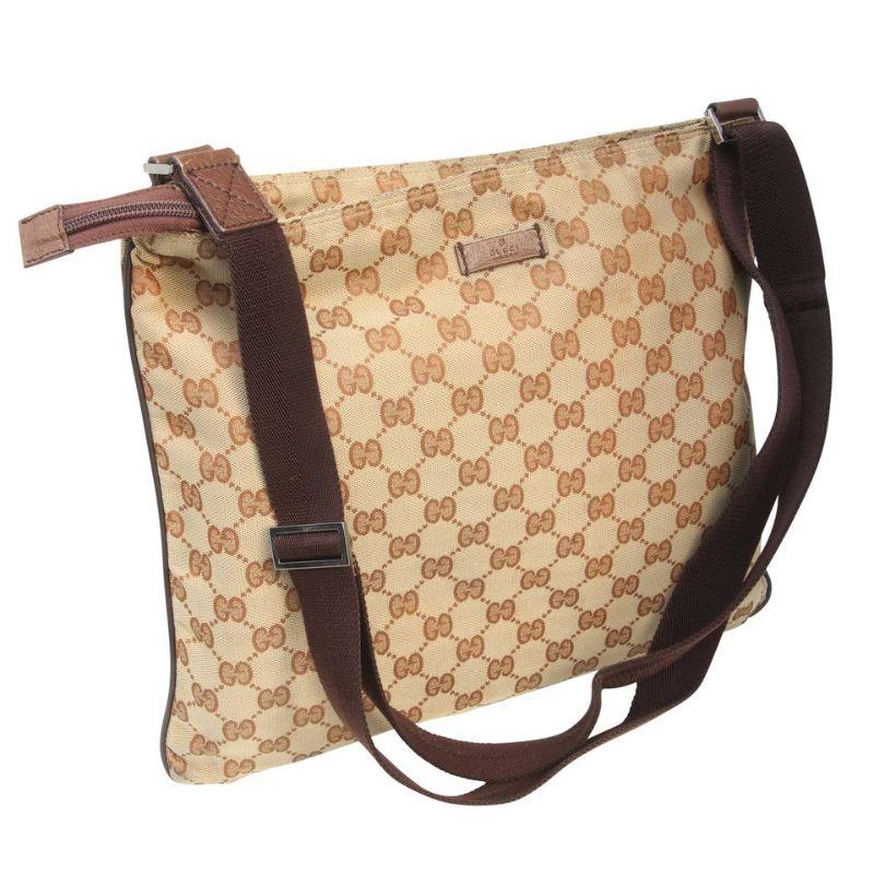 Gucci Messenger Bag Canvas Medium Brown Soft GG Supreme Satchel

THis Gucci Supreme GG Canvas Messenger Bag makes a perfect everyday bag. It features durable GG fabric canvas with single zip closure, leather trim and an adjustable brown strap that