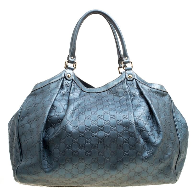 A handbag should not only be good-looking but also functional, just like this pretty Sukey tote from Gucci. Crafted from the signature Guccissima leather in Italy, this gorgeous number has dual handles on top and a logo-engraved dangling charm. The