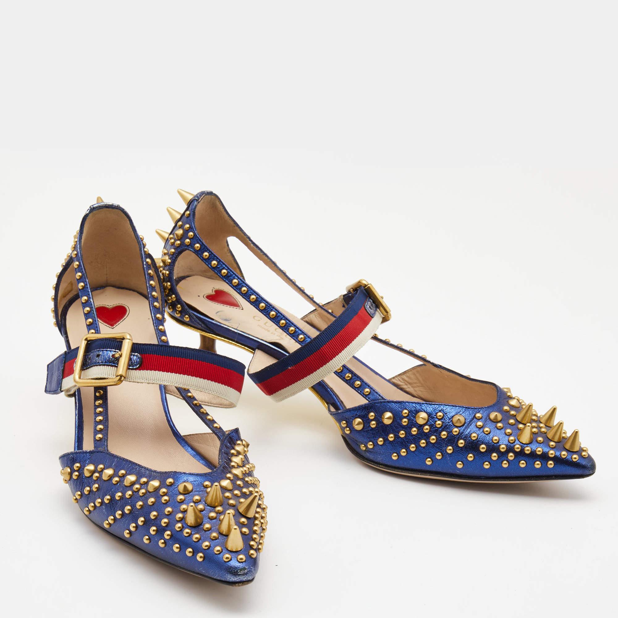 These pointed-toe Unia pumps from Gucci have come straight from a shoe lover's dream. Crafted from blue leather, detailed with gold-tone studs all over along with signature Web straps on the ankle and are balanced on short bamboo heels. The pumps