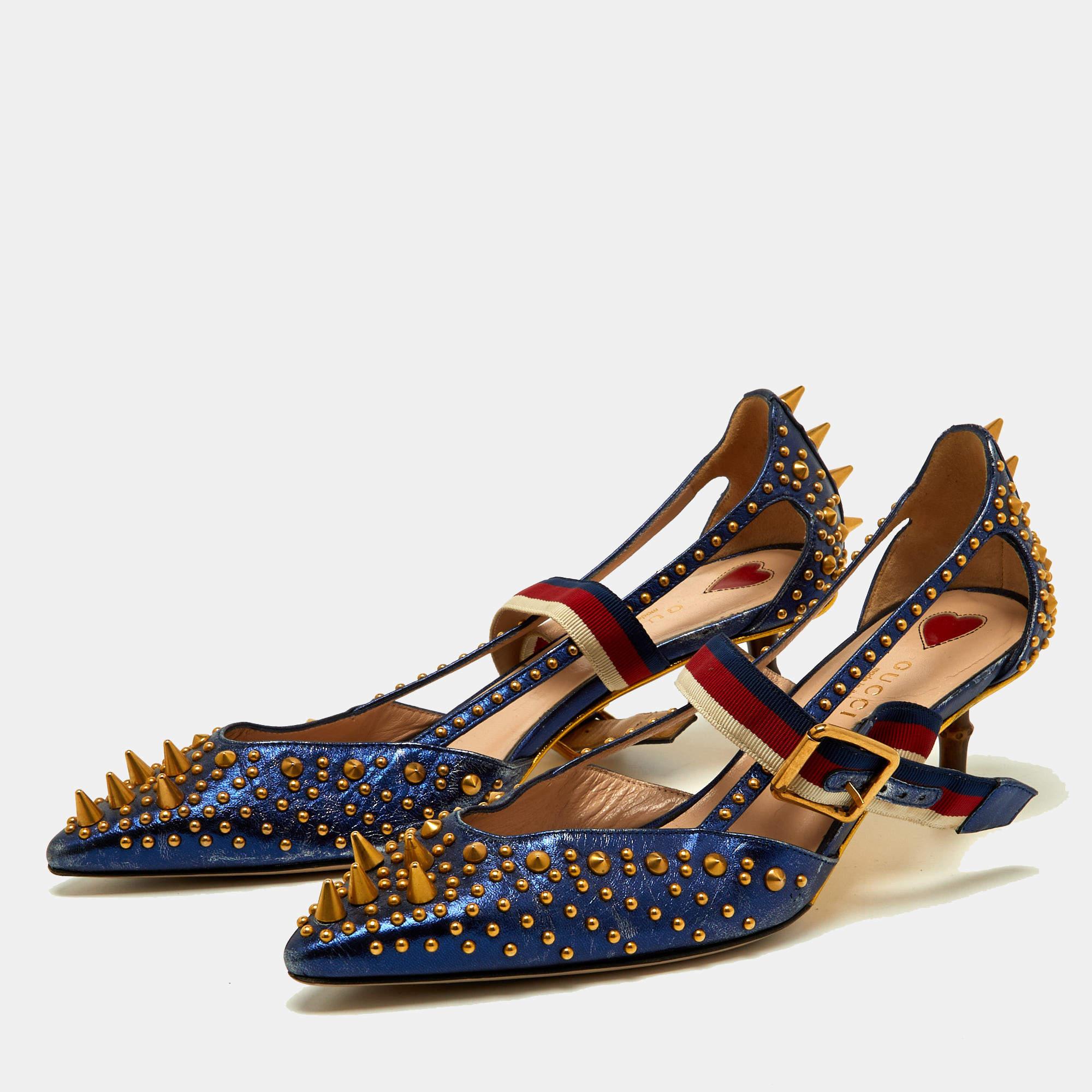 These pointed-toe Unia pumps from Gucci have come straight from a shoe lover's dream. Crafted from blue leather, detailed with gold-tone studs all over along with signature Web straps on the ankle and are balanced on 5.5cm heels. The pumps are