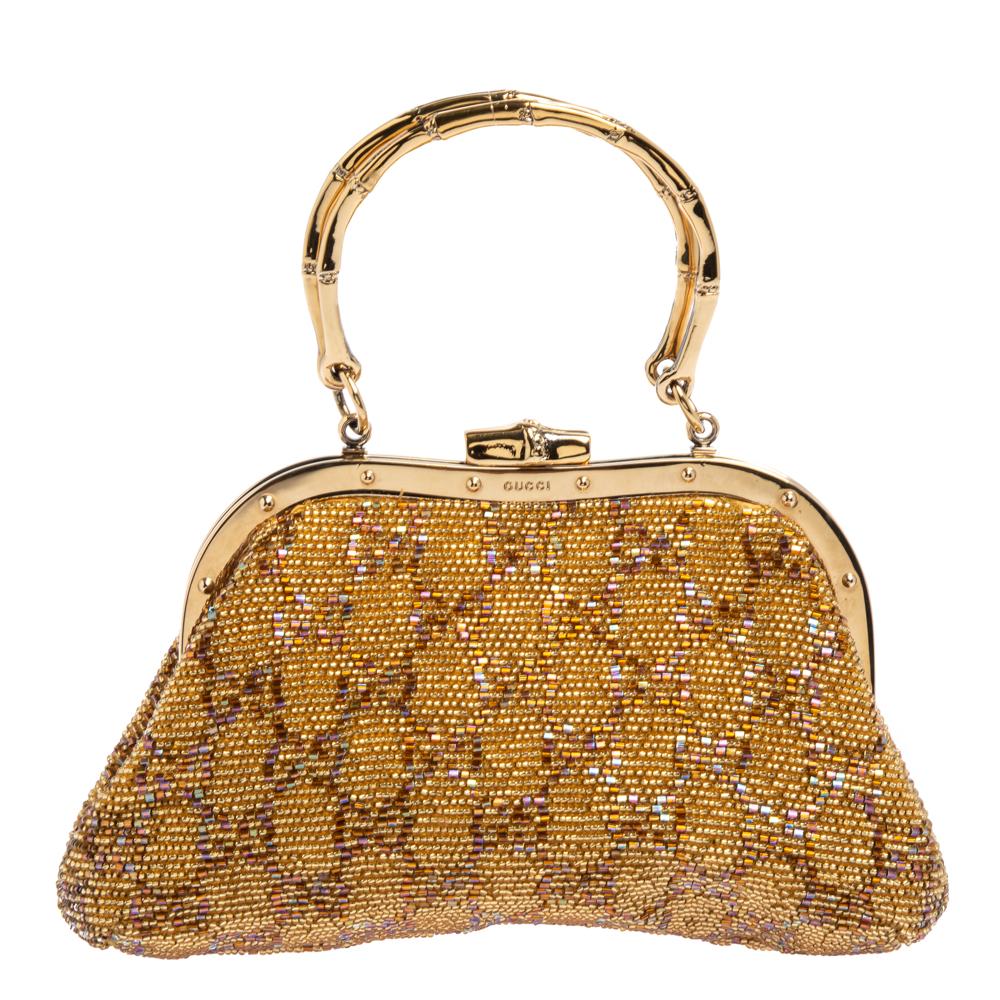 Embrace your partywear with this beautiful frame bag. Designed to perfection, it features a framed top, decorated with beads on the exterior. The interior of this bag is lined with leather and houses a slip pocket. This Gucci handbag will elevate