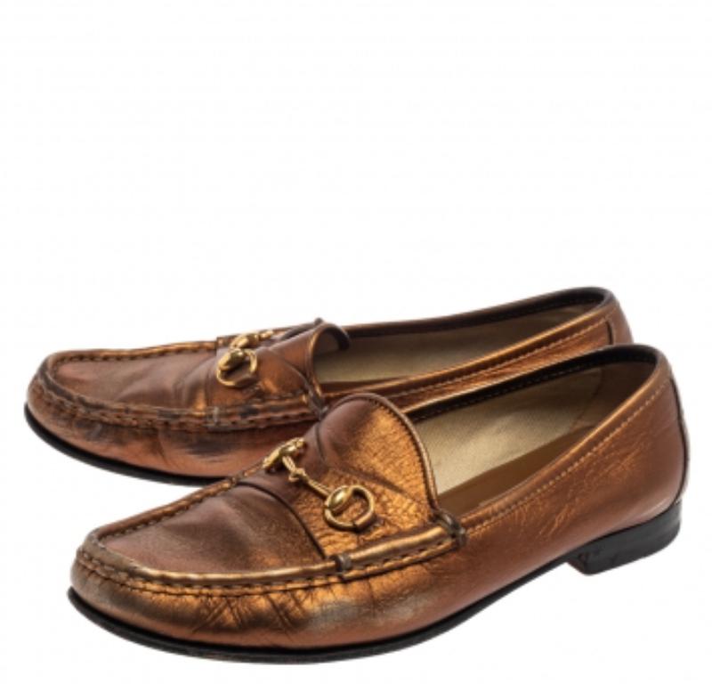 The Horsebit loafers by Gucci come in metallic gold leather with this pair. Sewn beautifully, the loafer features the inimitable Horsebit motif on the uppers, soft leather insoles for all-day comfort, and durable soles for lasting wear.