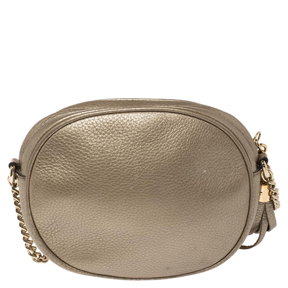 Fancy bags are a wardrobe must-have. Made in Italy, this Soho Disco bag by Gucci has been crafted out of metallic gold leather, lined with canvas on the insides, and sized to fit in your essentials. It has gold-tone hardware, top zip closure with a