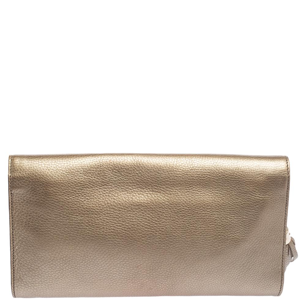 A fancy creation like this Soho clutch is certainly a must-have. This clutch from Gucci helps you attain an admirable style as you carry it with you. It is made using metallic-gold pebbled leather on the exterior with an embossed logo detail