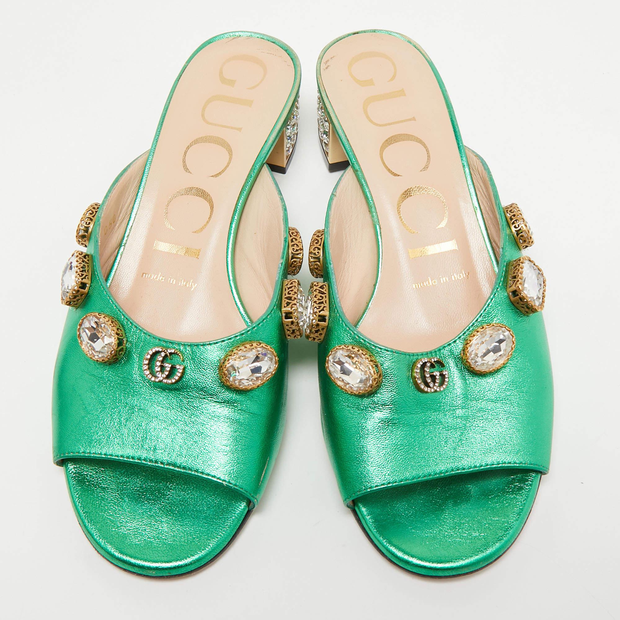 These slides by Gucci showcase a lovely design. Crafted from leather, the slides feature open toes and crystal-embellished uppers. They come with leather-lined insoles and block heels. Wear them with any outfit for an elegant take.

