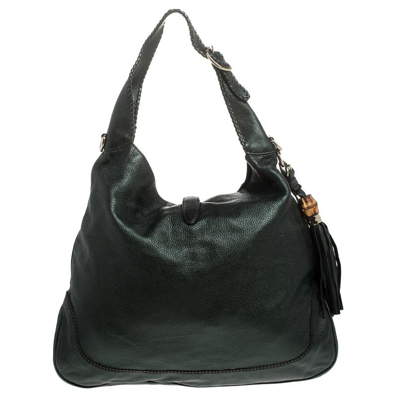 A handbag should not only be good-looking but also durable, just like this lovely metallic green New Jackie hobo from Gucci. Crafted from leather in Italy, this gorgeous number has the signature closure that opens up to a spacious canvas interior.