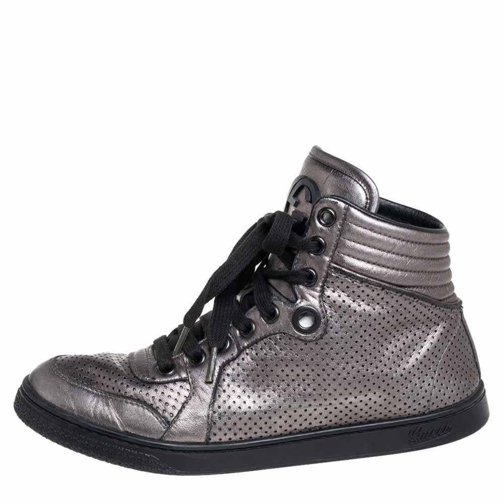 Gucci's sneakers are an example of style and comfort coming together. Crafted from grey leather, these sneakers flaunt details like the quilted counters, laces, perforations, and the raised high top. You wouldn't want to miss out on such a cool pair