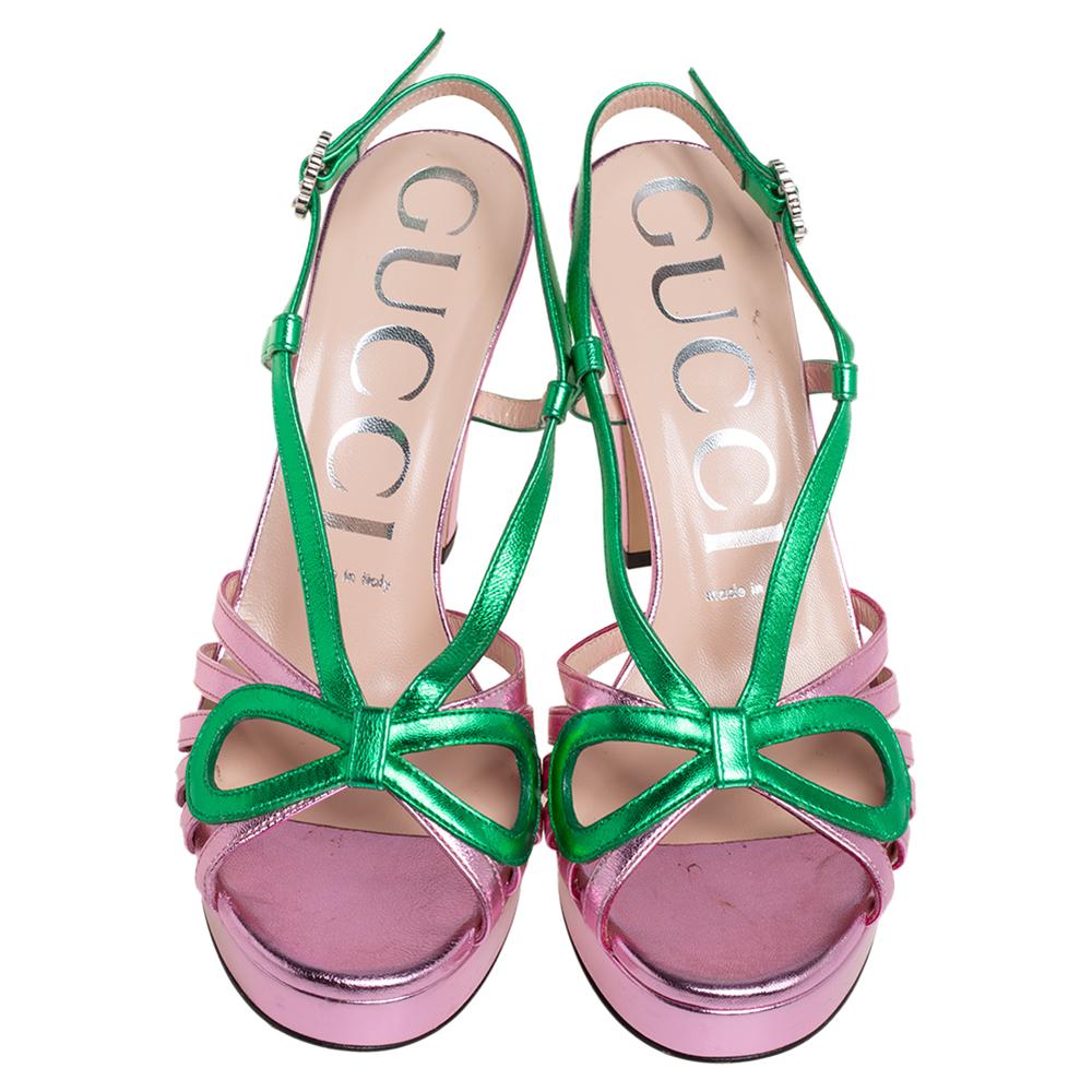 Straps in metallic pink and green leather have been used to form this gorgeous pair by Gucci. The strappy layout, open toe, and embellished buckle closure are added to frame your feet in an alluring way. Platforms and 10.5 heels finish the luxe